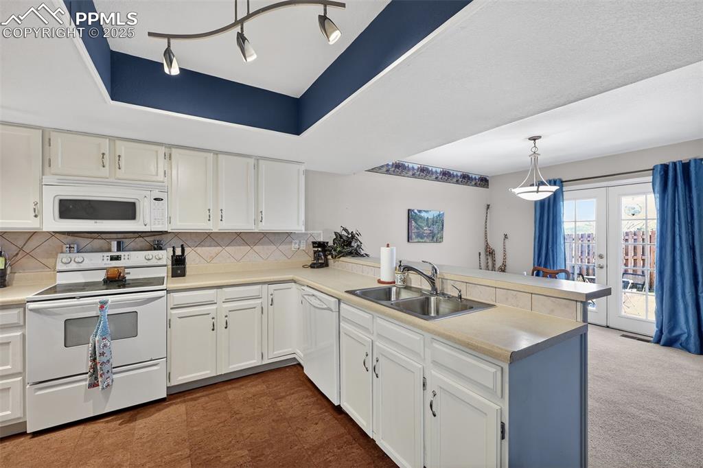 Pan ceiling for architectural interest and the cork floors are soft on the feet!