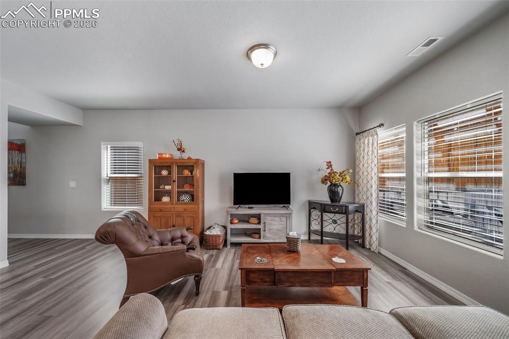 Hard surface luxury vinal plank flooring in the living room and throughout the main level. 
