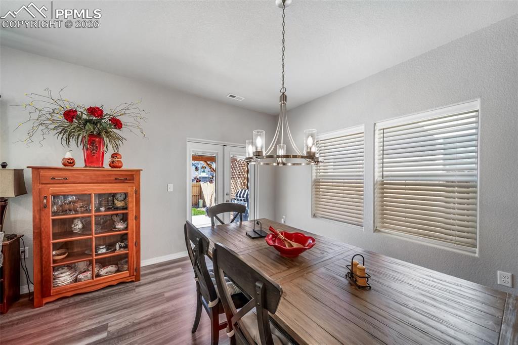 Double door exit to the back patio is an upgrade not usually found in this price point of home. 