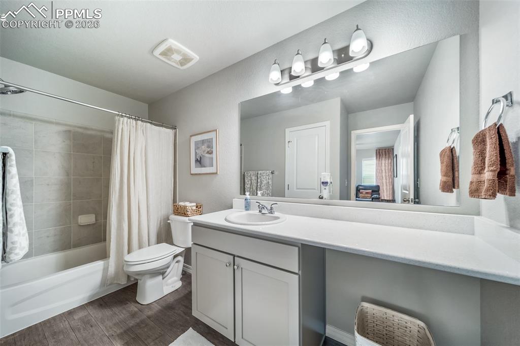 Ceiling fan in the second upstairs bedroom. Don't buy new and be stuck installing your own fans. This home is already done! 