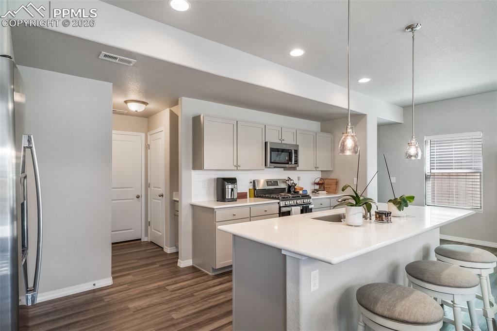 Open concept kitchen with eat in island.