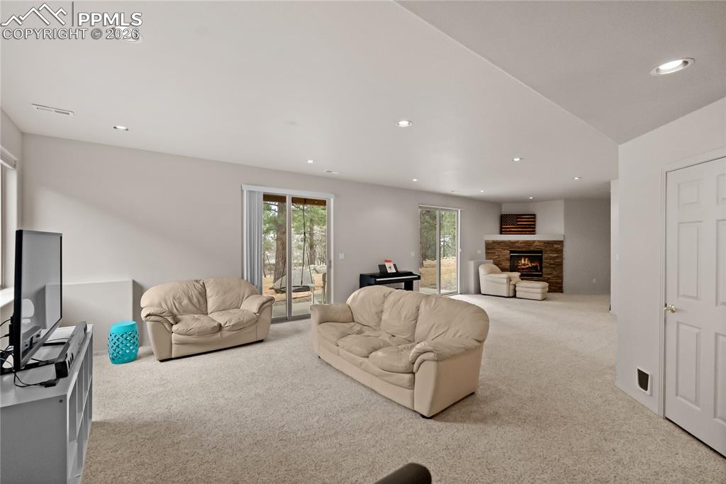Basement family room with fireplace.