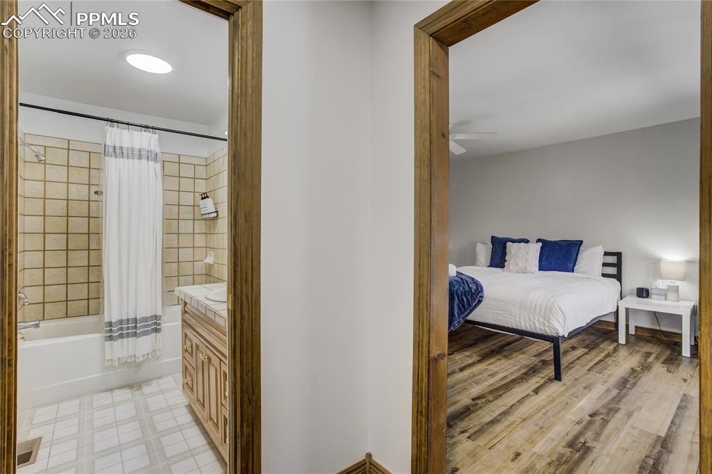 Photo of primary bathroom and bedroom