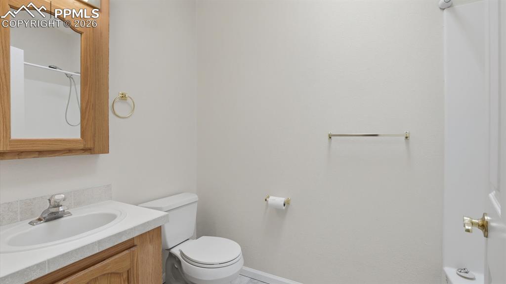 Full Bathroom with vanity, framed mirror, and tub/shower.