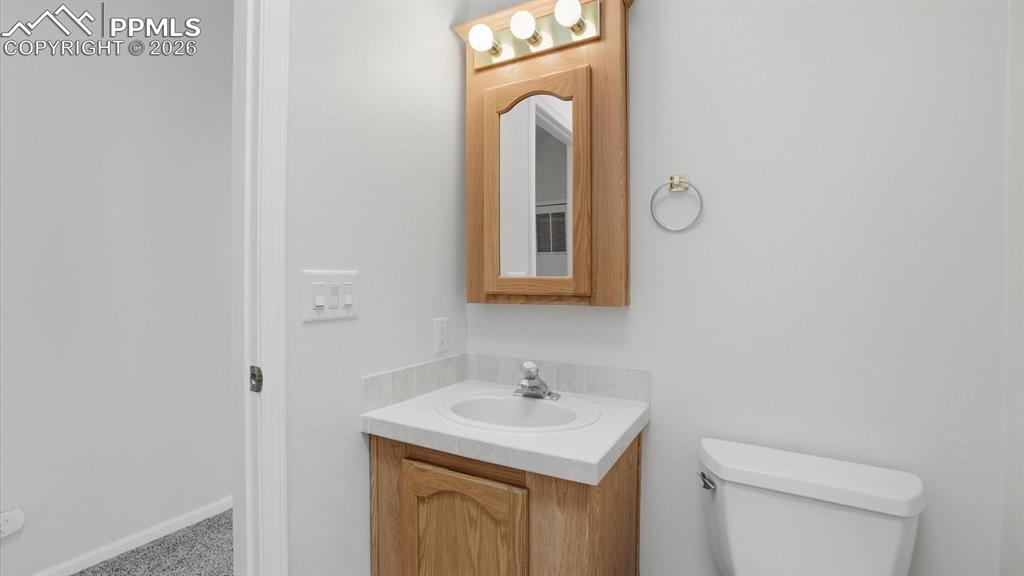 Vanity and framed mirror in the Full Bathroom.