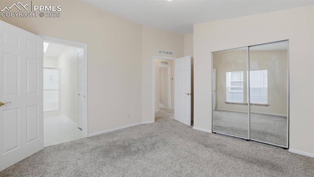 The Primary Bedroom featured a mirrored wardrobe closet and adjoining Shower Bathroom.