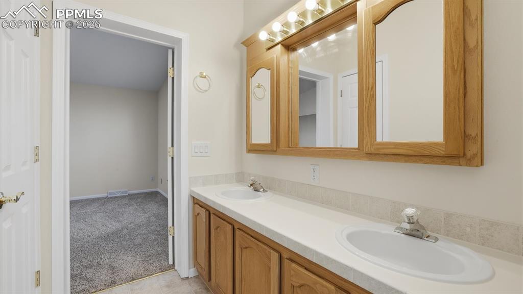 View into the Primary Bedroom from the Primary Bathroom.