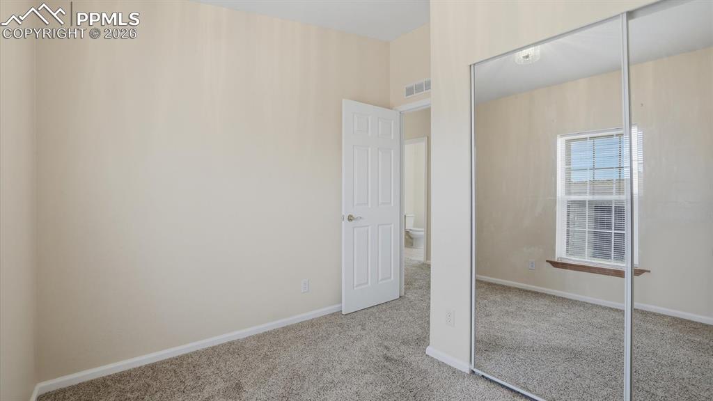 Bedroom #3 offers a mirrored wardrobe closet.