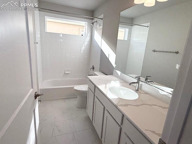 Hall Bathroom with Quartz Countertop and Tile Surrounds! Located on the upper level!