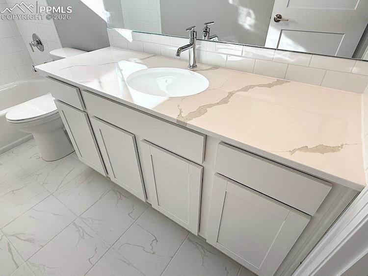 Hall Bathroom with Quartz Countertop and Tile Surrounds! Located on the upper level!