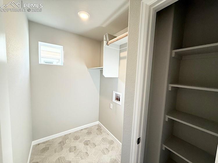 Laundry room with a closet, conveniently located on the upper level!