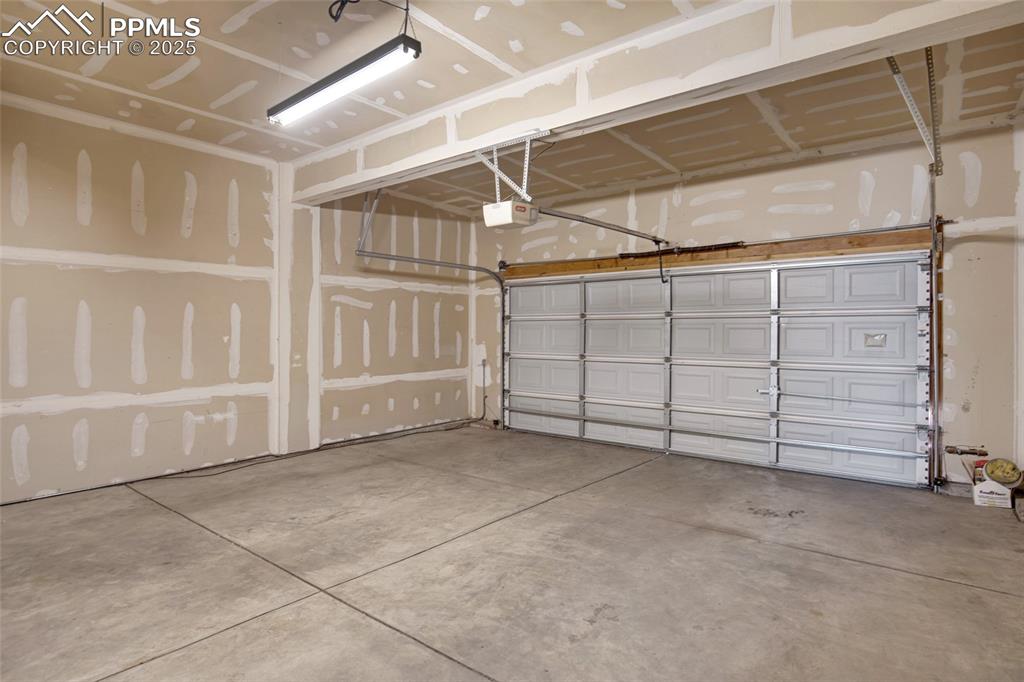 Garage featuring a garage door opener