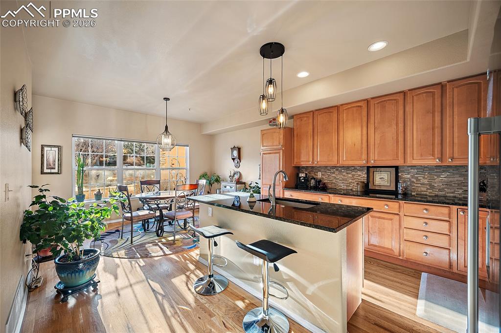 Open kitchen that walk out to the patio. Granite countertops and gorgeous backsplash. 