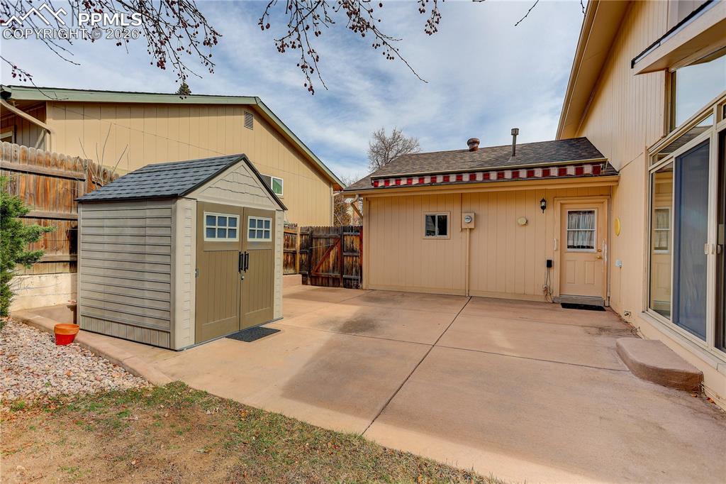 Large concrete patio has a retractable Sunsetter awning and a good sized storage shed. Easy access from either the laundry room or Sunroom.