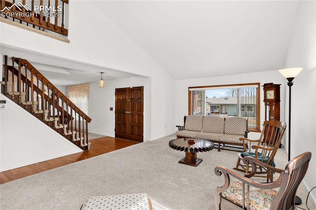 Front entry leads to a large living room with vaulted ceilings
