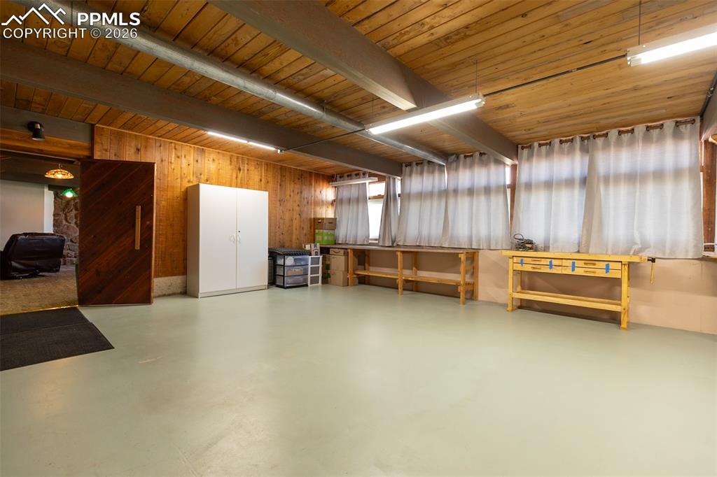 Garage featuring wooden walls