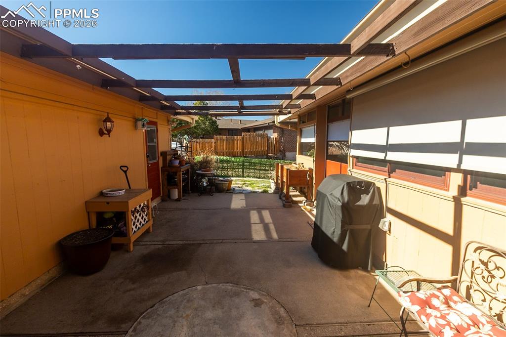View of patio / terrace with grilling area and a pergola
