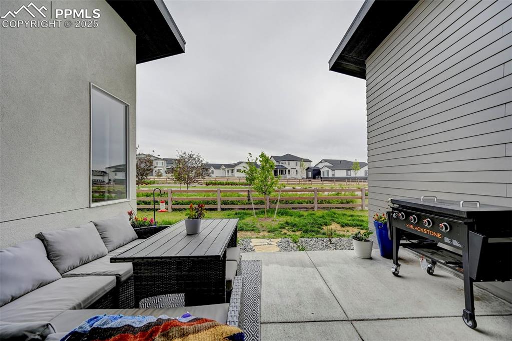 View of patio featuring an outdoor hangout area and a residential view