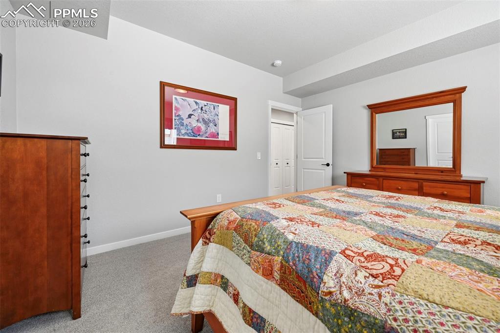 3rd Bedroom - Basement - featuring light carpet and baseboards