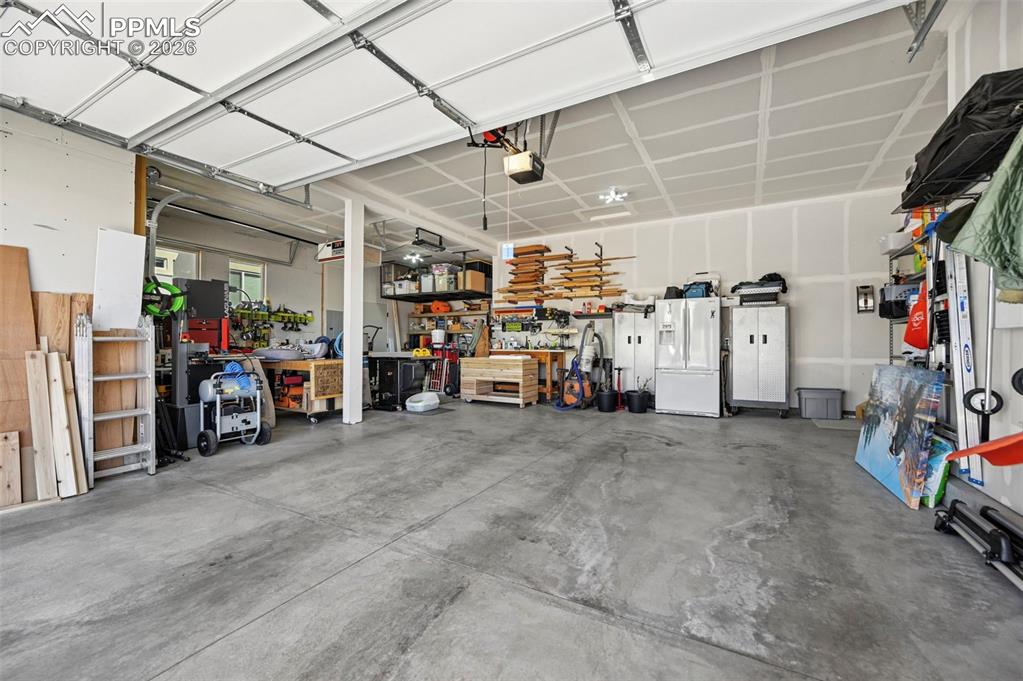 Garage featuring workshop area