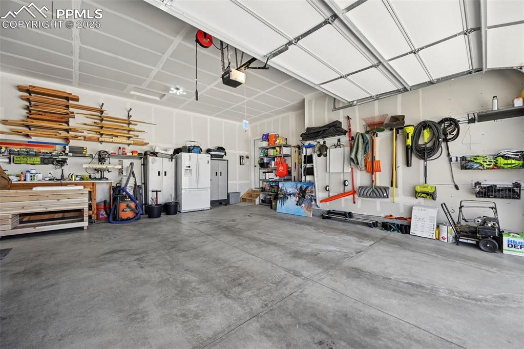 Garage featuring a workshop area 