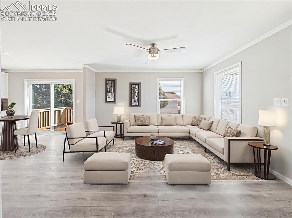 Virtually Staged Family Room – Shown here with a large sectional and accent seating, this family room layout showcases its capacity for comfort and connection.