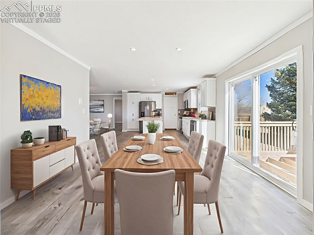 Virtually Staged Dining Area – This staged dining space off the kitchen offers a sunny setting next to sliding glass doors, perfect for indoor-outdoor meals and gatherings.
