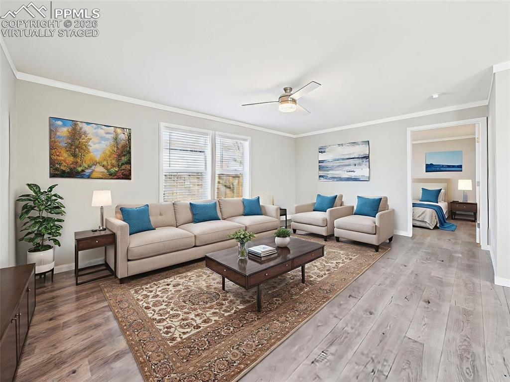 Virtually Staged Family Room – Thoughtfully staged to show the flexibility of the secondary living area, with modern furnishings and effortless flow into the kitchen.