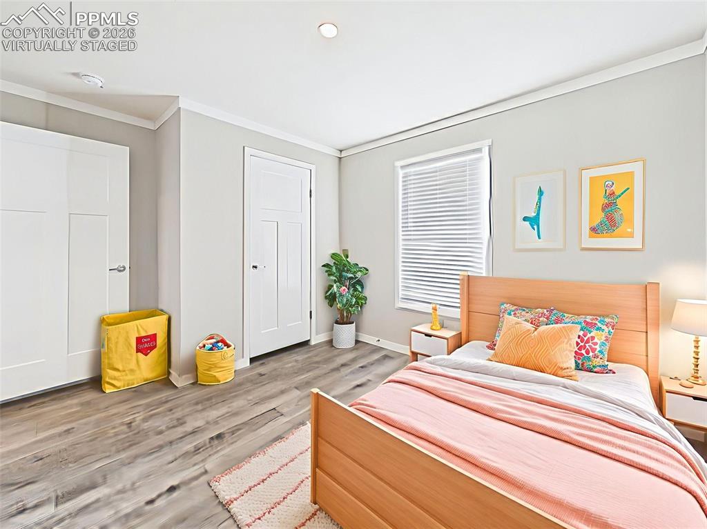 Virtually Staged Secondary Bedroom – Perfectly staged for a child’s room or guest retreat, this bedroom features soft gray walls and a double-door closet.