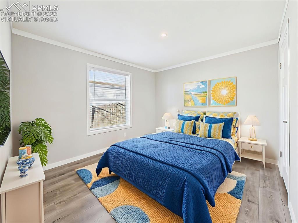 Virtually Staged Bedroom #3 – A cheerful and spacious bedroom setup with room for a full-size bed and additional furnishings, bathed in natural light from a large window.