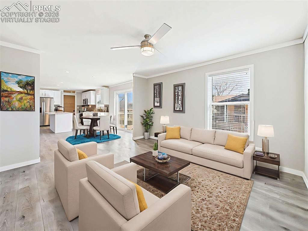 Virtually Staged Dining & Living Area – This digitally enhanced view highlights the open-concept layout with defined dining and living zones, perfect for both everyday living and entertaining.