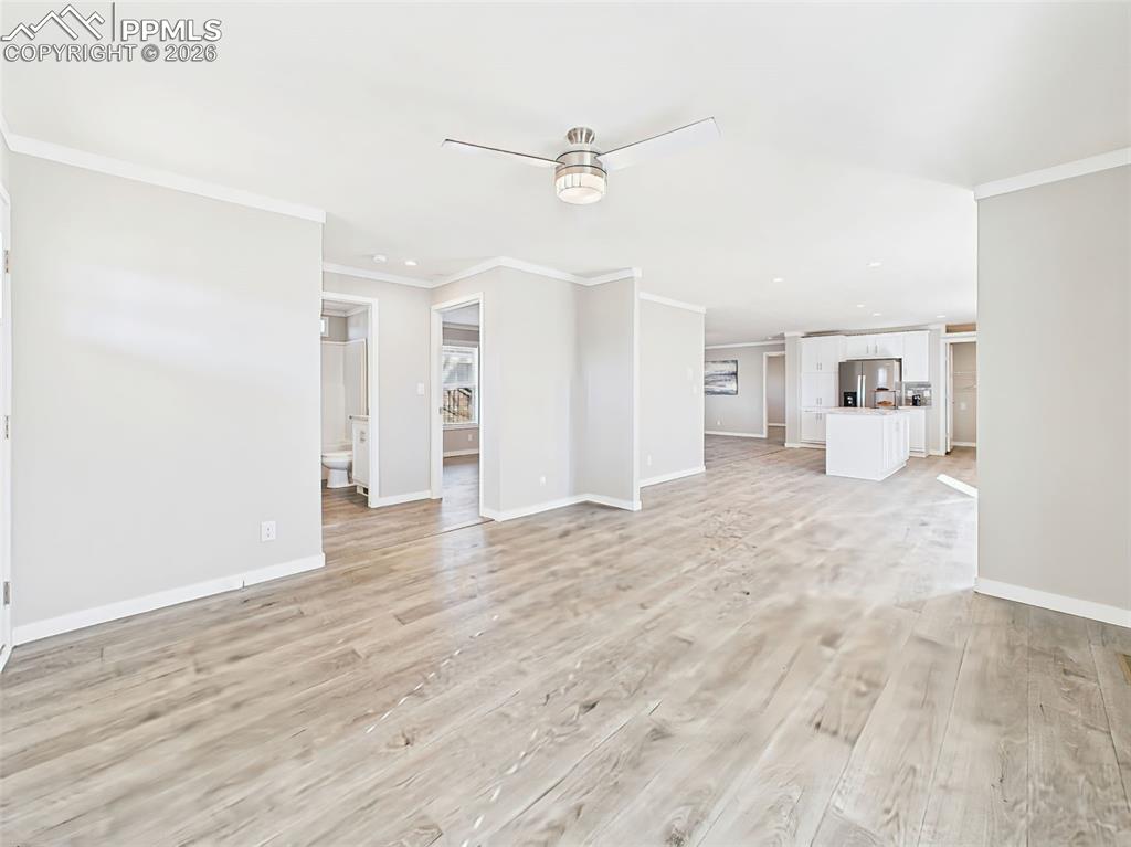 Living Room (Unstaged) – Just off the front entry, this welcoming living room showcases clean lines, neutral tones, and double windows for great natural light.