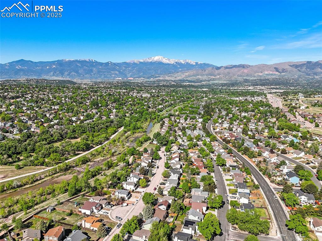Aerial view of residential area with a mountainous background
