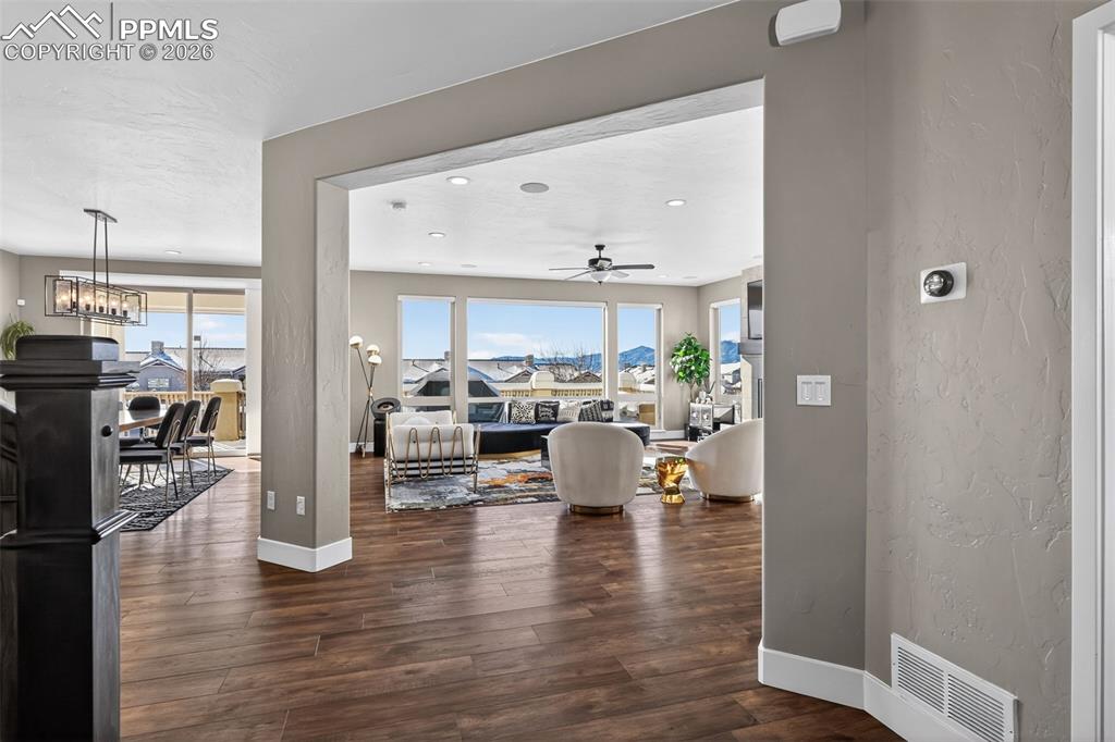 entry leading to large family room with views of Pikes Peak