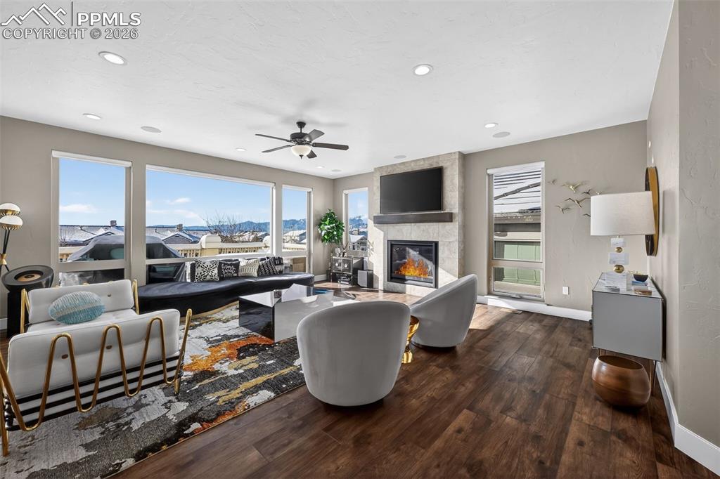 Large open concept living room with views of Pikes Peak