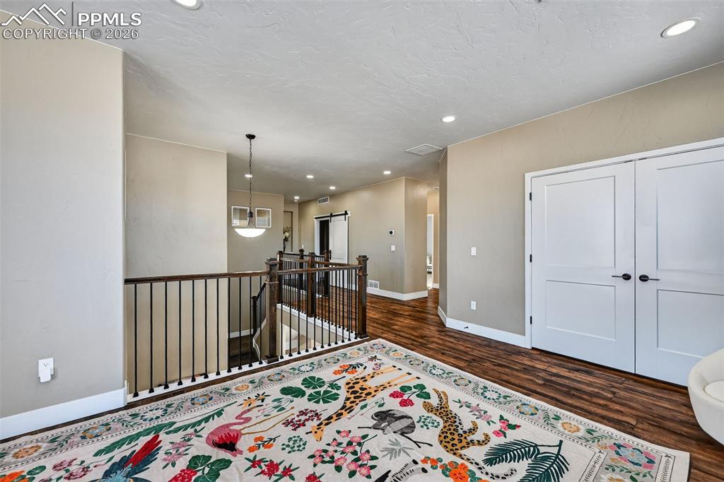 upper level foyer with loft and plenty of storage space
