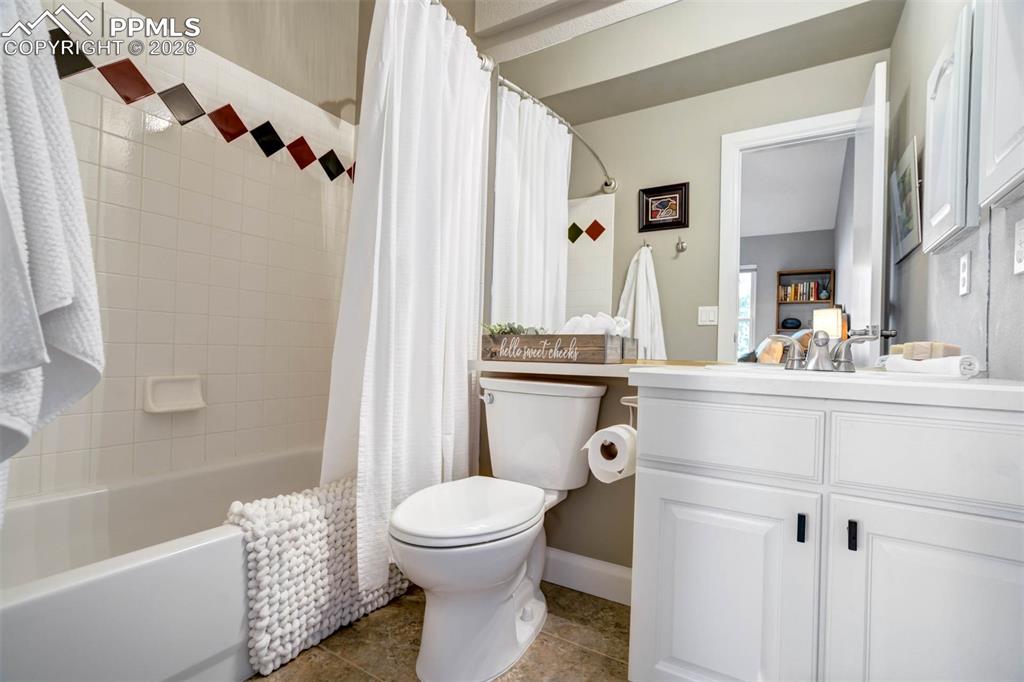 Bathroom 4 featuring bath/shower, toilet and single sink. 
