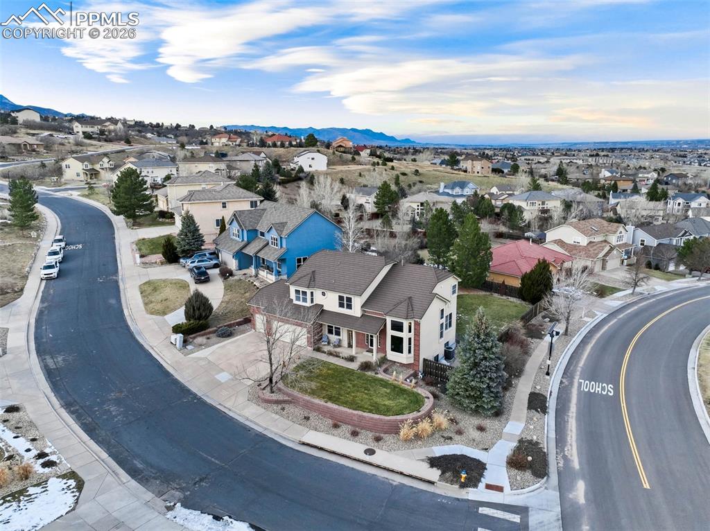 Aerial view of residential area featuring a mountainous background