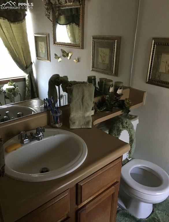 Bathroom featuring vanity and toilet