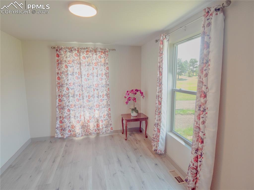 Empty room with wood finished floors