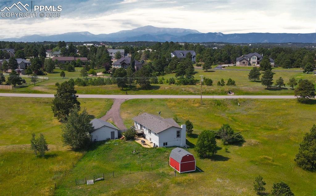 Aerial view of sparsely populated area with a mountain backdrop