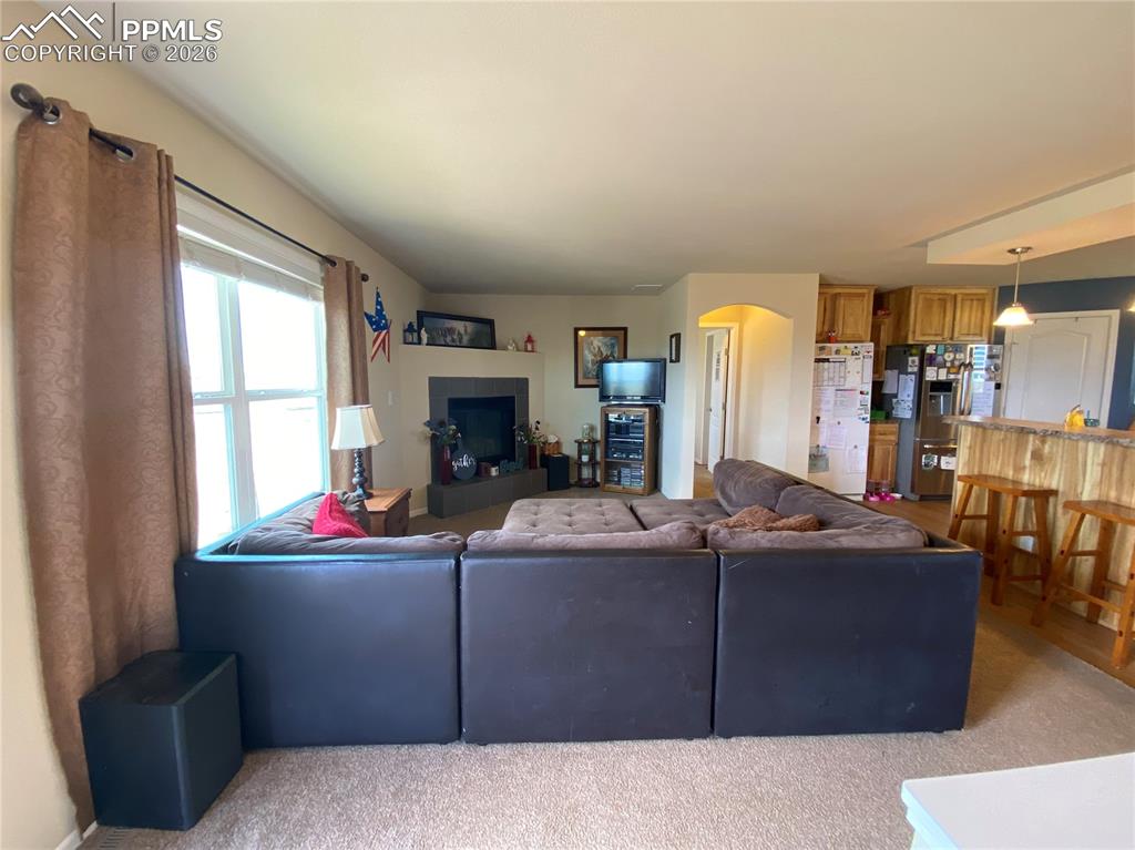 Bright, spacious living room with large windows that fill the home with natural light