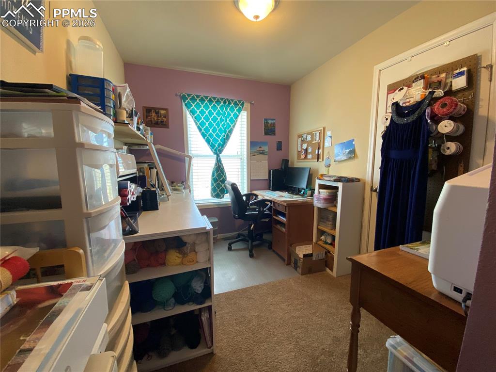 Versatile third bedroom on the main level—perfect for a home office, craft room, or guest suite—ideal for flexible living and work-from-home needs.