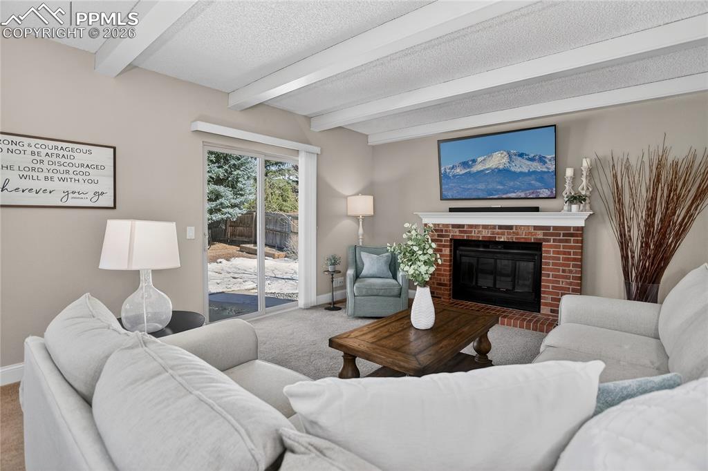 Family room w/ woodburning fireplace
