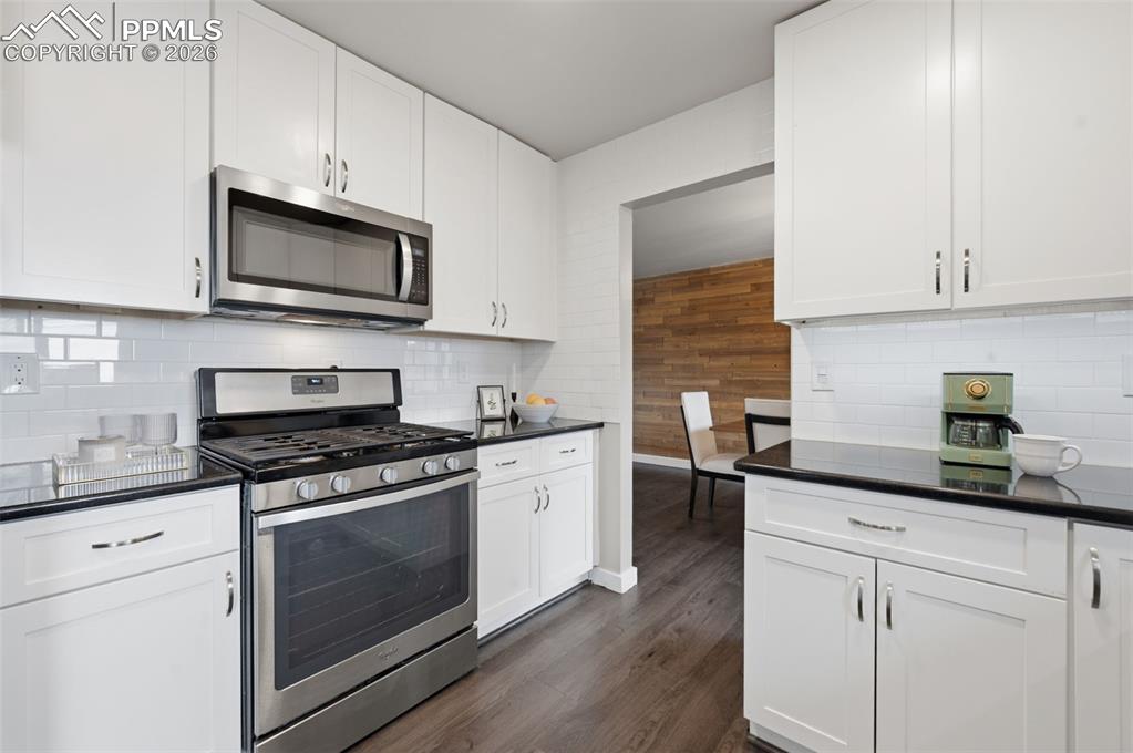 Kitchen wide looking into dining area