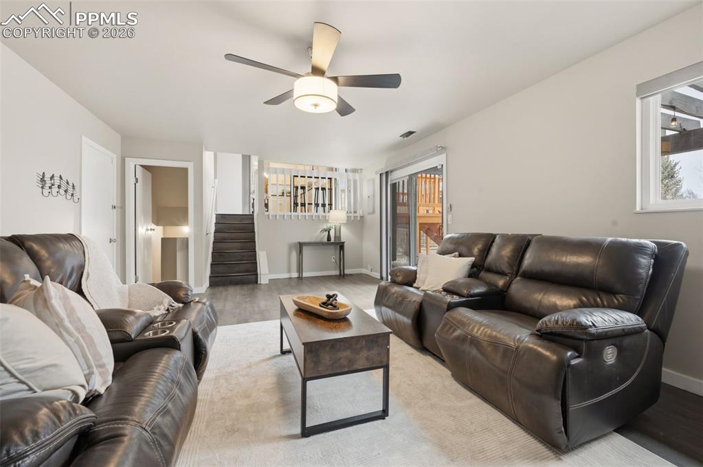 Lower family room facing kitchen and basement entrance