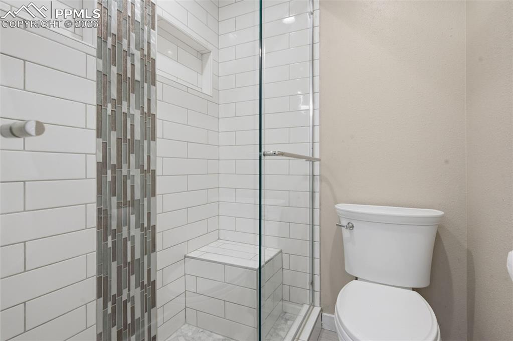 Primary bathroom shower and toilet