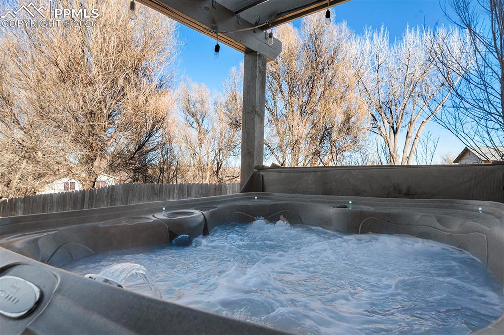 Hot tub off the lower family room under pergola
