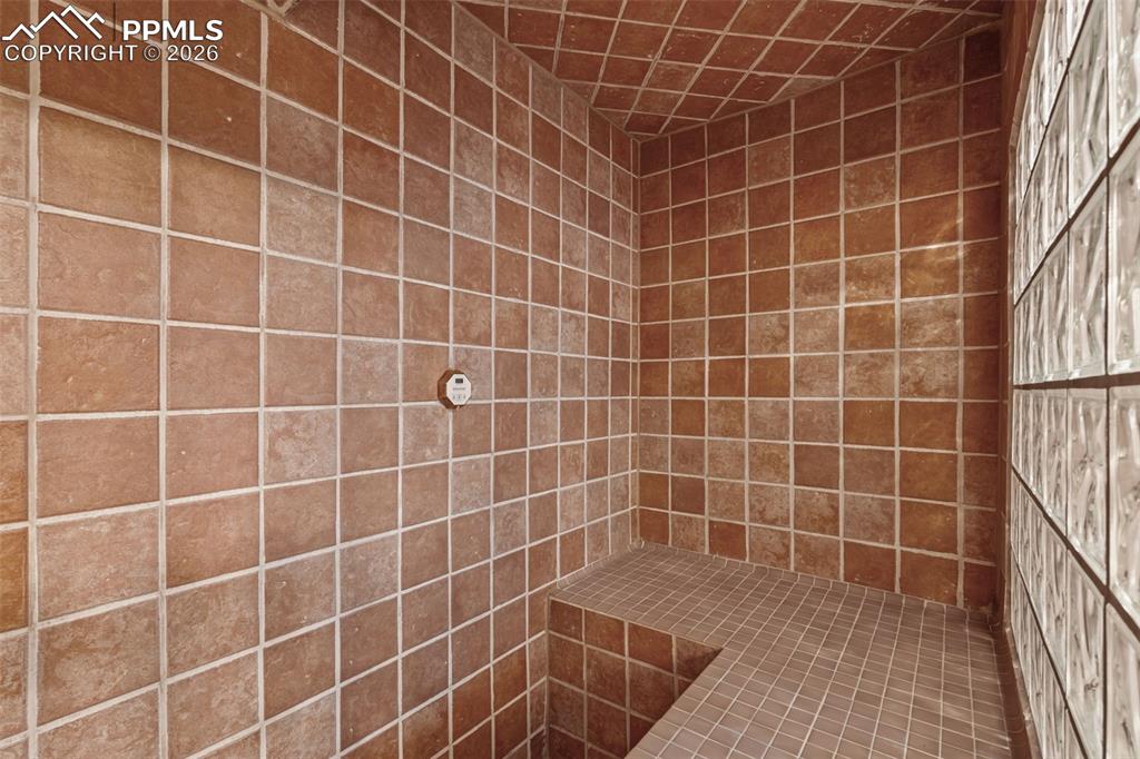Full bathroom with tiled shower