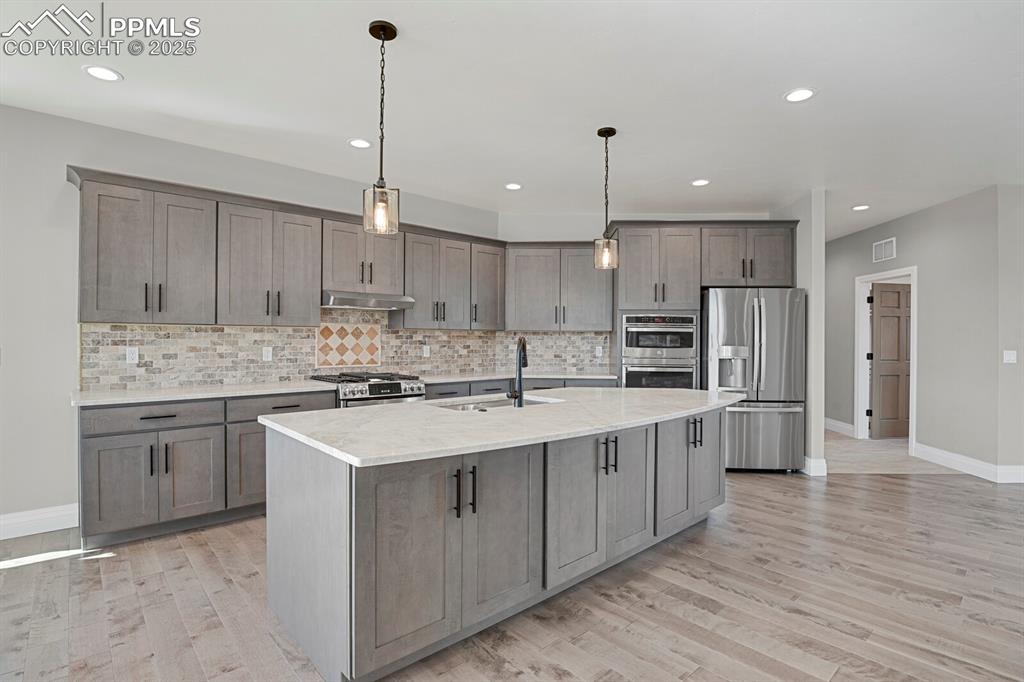Kitchen and view of access to laundry room on the right